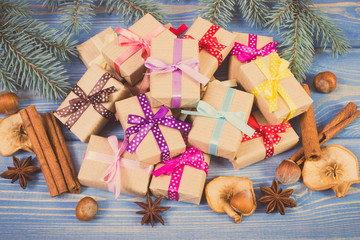 Vintage photo, Wrapped gifts with ribbons for Christmas, spices and spruce branches