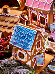 Make gingerbread hause for holiday christmas. Several Christmas ginger houses top view. Decorating Xmas table is fun holiday tradition. How to Make Decorating Party for holiday.