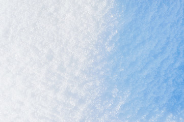 Winter background. Sparkling blue snow