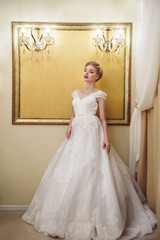 Obraz premium Full length portrait of beauty bride in white dress. Classic sty