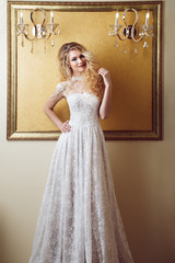 Full length portrait of beauty bride in white dress. Classic sty