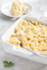 mac & cheese, baked macaroni and cheese in white casserole dish