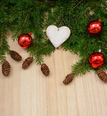 Christmas fir tree decorated on wooden background