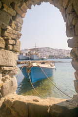 Old boat at Paros island in Greece. View from inside the Kastelli castle.
