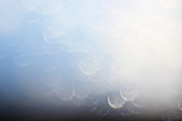 light blue background bokeh drops glass, blurred