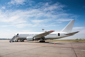 Fototapeta na wymiar Ground handling wide-body passenger aircraft