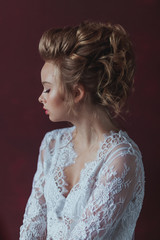 Beautiful young blond bride with fashion wedding hairstyle
