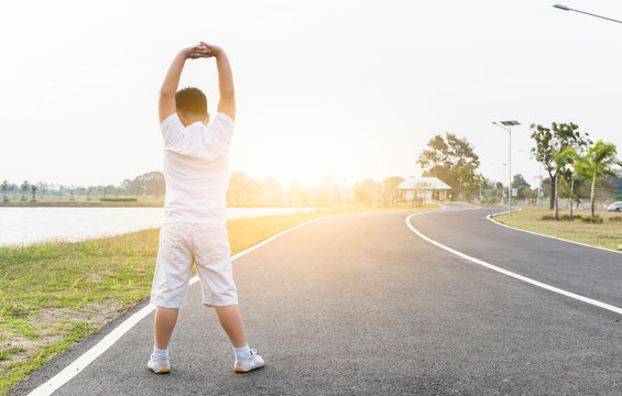 Obese Fat Boy Exercise At Park On Morning