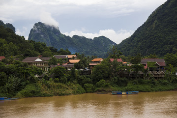 Fototapeta na wymiar Village on the riverbank in Laos
