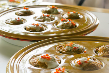 Knmcrk with coconut dipping on top thai style food recipe