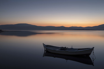 Fototapeta na wymiar Beautiful sunset with fishing boat