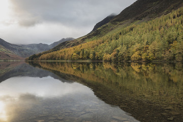 Beautiful Autumn Fall landscape image of Lake Buttermere in Lake
