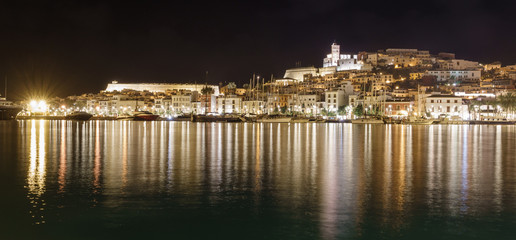 Ibiza Dalt Vila downtown at night with sailing boats
