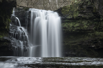 Beautiful waterfall landscape image in forest during Autumn Fall