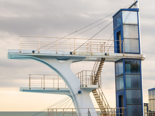 Diving tower and cloudy sky as background