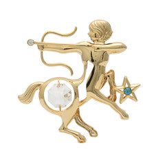 Sagittarius gold brooch isolated on white