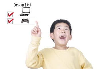 Happy young boy thinking dream list