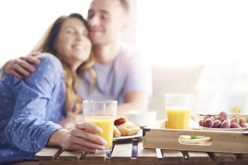 Obraz na płótnie Canvas Couple enjoying their breakfast meal together