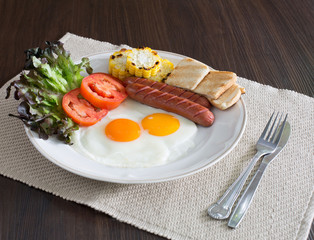 American breakfast with vegetables in white dish