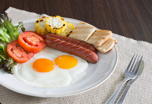 American breakfast with vegetables in white dish