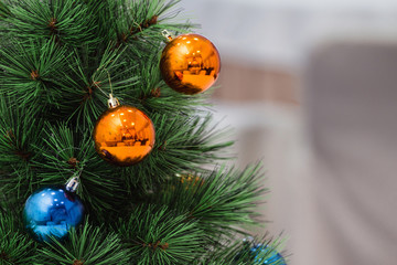 Christmas Balls Decorations hanging on New Year Tree with copy space