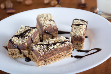 Chocolate cake with walnut cut into squares