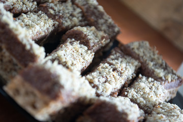Chocolate cake with walnut cut into squares