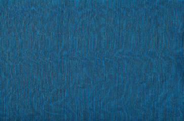 Black transparent caprone cloth on a blue background