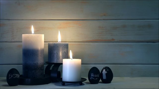 This is a video of blue candles on a urban peeling wood background with copy space for religious and holiday concepts