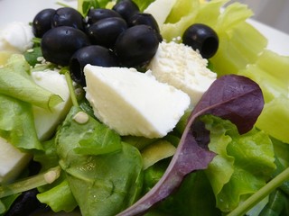 green salad with mozzarella cheese and olives