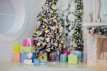 Christmas tree with presents in the interior