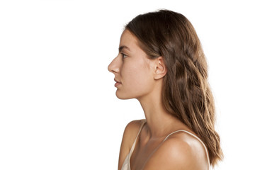 profile of young beautiful woman with long hair and without makeup