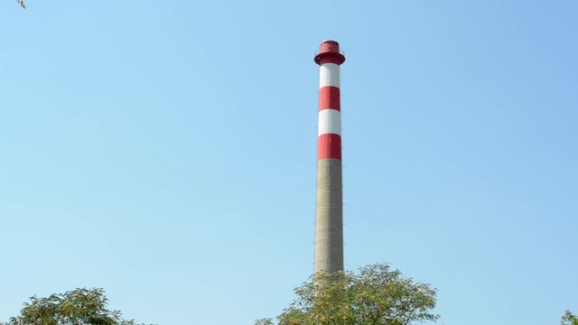high industry chimney without smoke in the countryside - clear sky