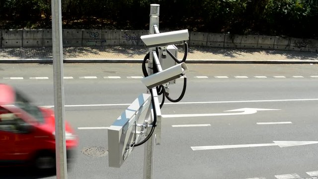 view of the security cameras in the street above the road