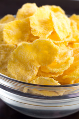 Defocused and blurred macro view of dry cornflakes
