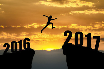 man jumping from 2016 to 2017