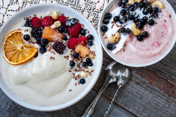 Smoothie bowl, banana ice cream with berries, nuts, flax. Perfect for the detox diet or just a healthy meal.  Love for a healthy raw food concept.