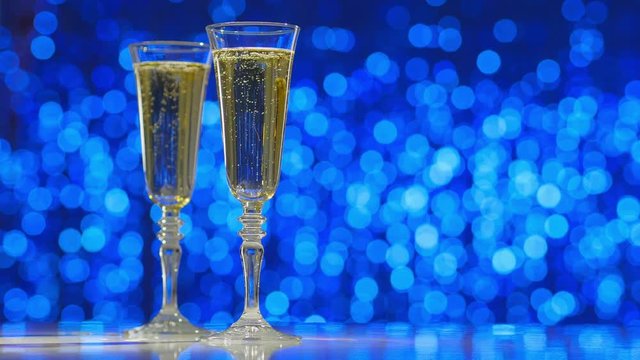 Two flutes with sparkling champagne.