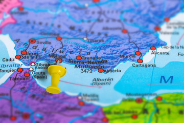 Malaga in Spain pinned on colorful political map of Europe. Geopolitical school atlas. Tilt shift...