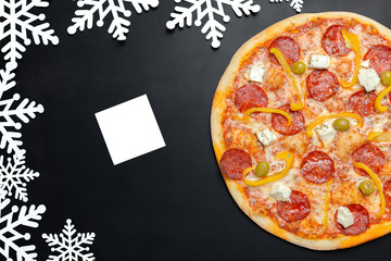 Pizza with snowflakes decoration. Winter pizza
