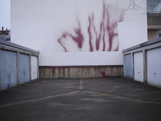 Series of garage doors in a parking area