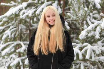 girl in a snowy winter forest. slum