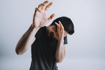 Man trying to protect himself with his arms