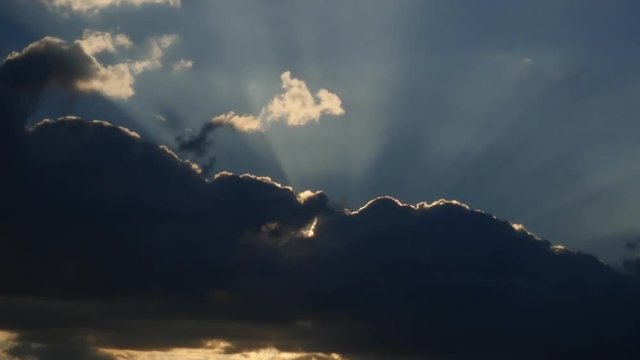 Sunrise Behind Silver Lined Clouds