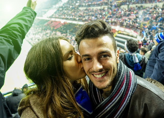 Selfie portrait of young couple watching sport soccer match