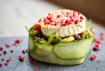 goat cheese salad with vegetables at restaurant