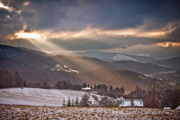 Śnieżny zimowy dzień w górskim mieście Muszyna. Snowy day in the mountain in Muszyna - Poland. © rogozinski