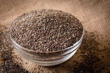 Chia seeds on wooden background