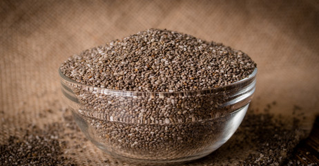 Chia seeds on wooden background