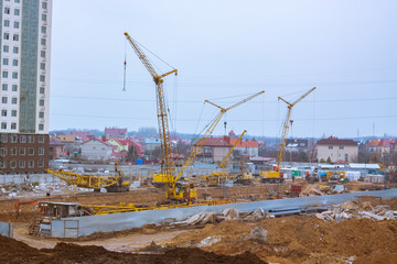 Fototapeta na wymiar Big construction yard with cranes 
